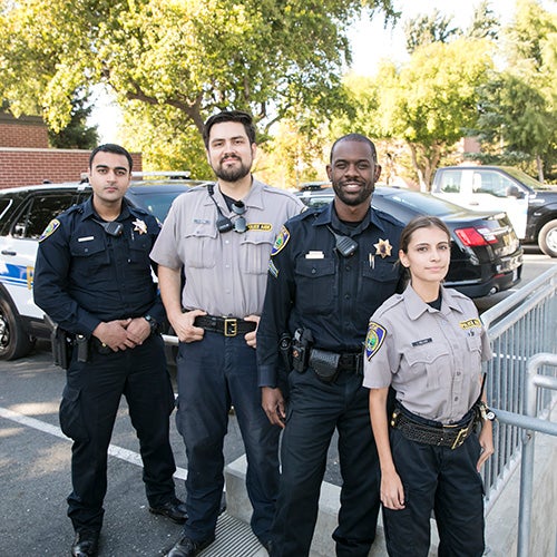 Officers and student cadets outside the DVC Police headquarters.