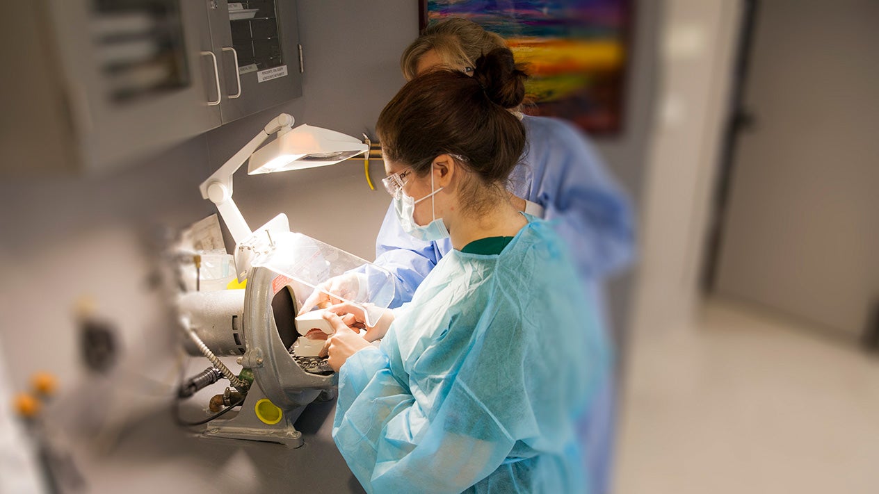 Dental students working in the clinic