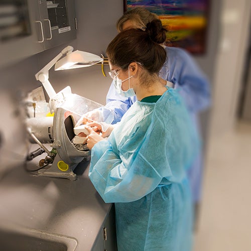 Dental students working in the clinic