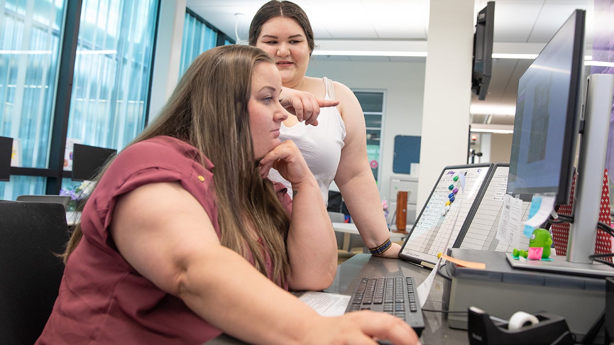 A counselor helps a DVC student.