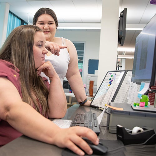 A counselor helps a DVC student.