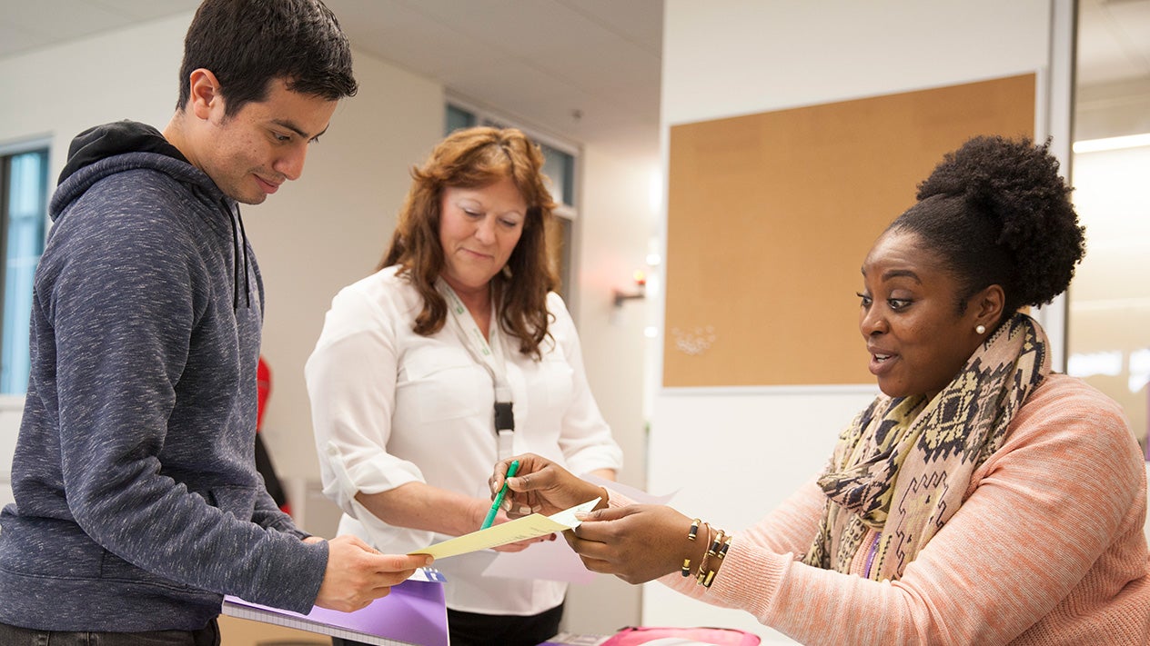 A DVC student works with Financial Aid counselors.