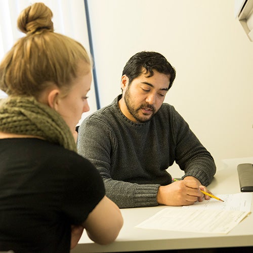 A DVC counselor works with a student.