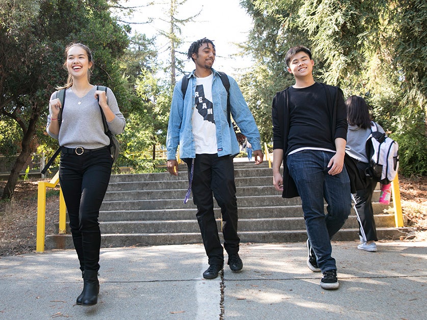 A diverse group of students walks together at DVC.