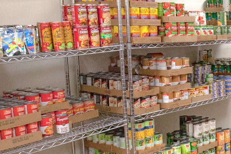 Shelves lined with canned goods and food.