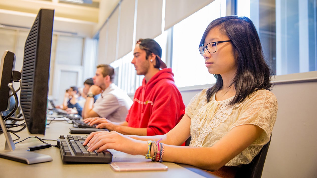 Students in a classroom working on computers