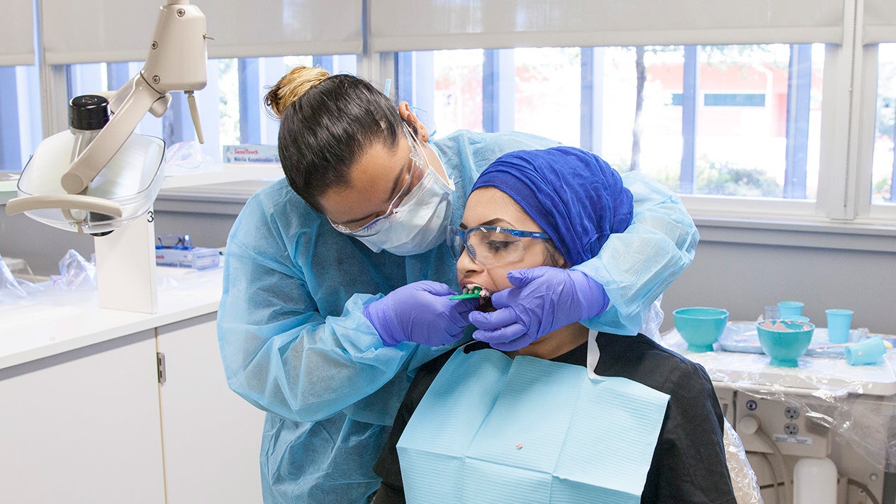 Dental Assistant and patient