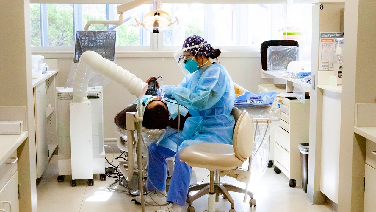 Dental Hygiene student with patient