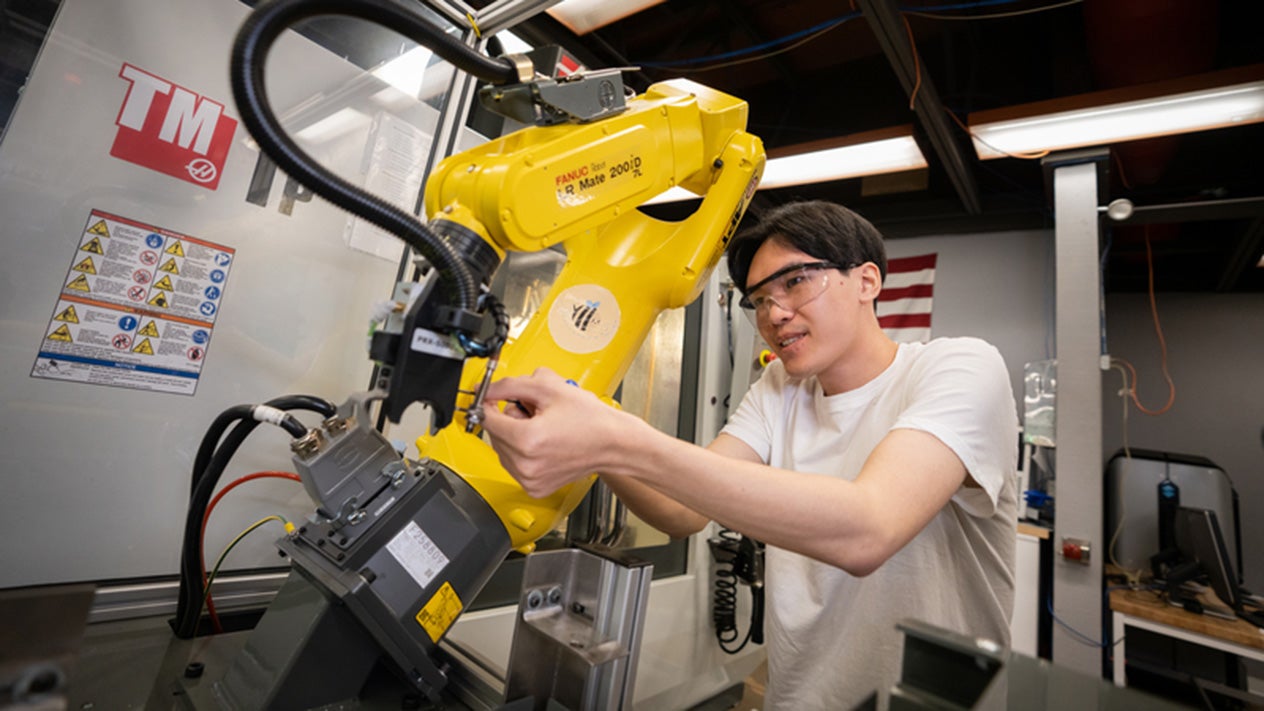 Engineering student working with robotics