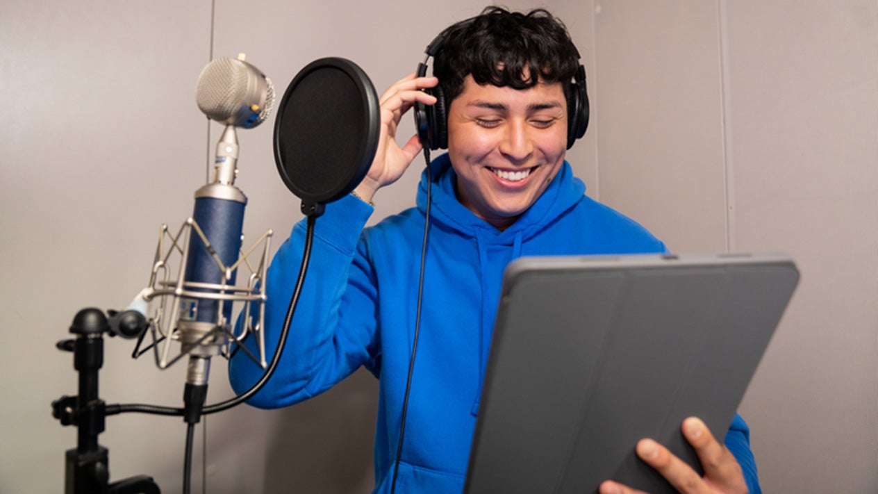 Student recording music in the Music Technology Center