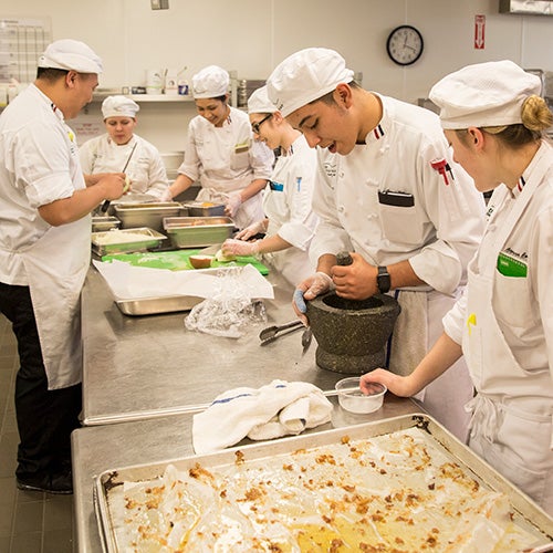 Culinary students in kitchen