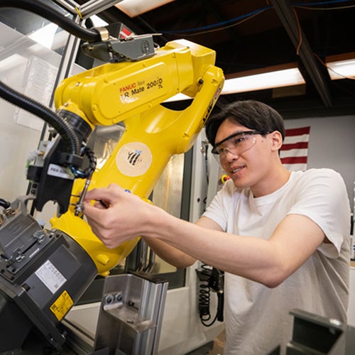 Engineering student working with robotics