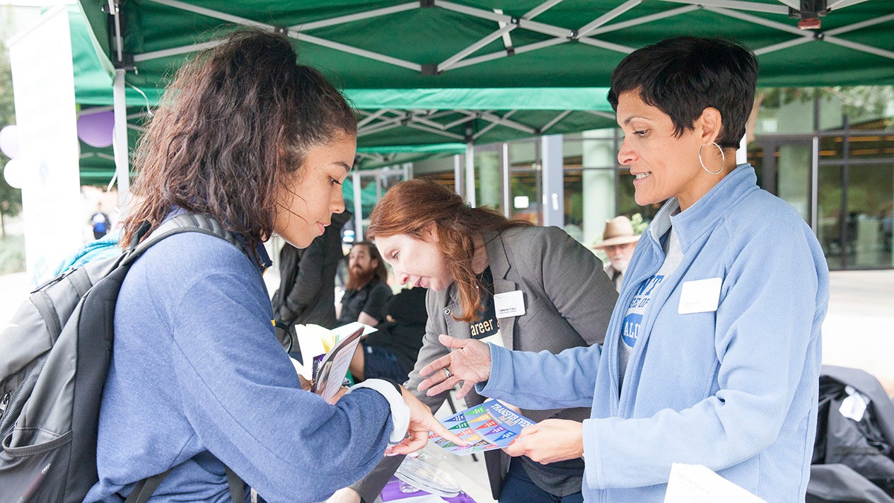 DVC students at a booth at an event on campus