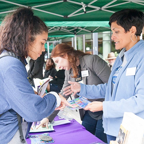 DVC students at a booth at an event on campus