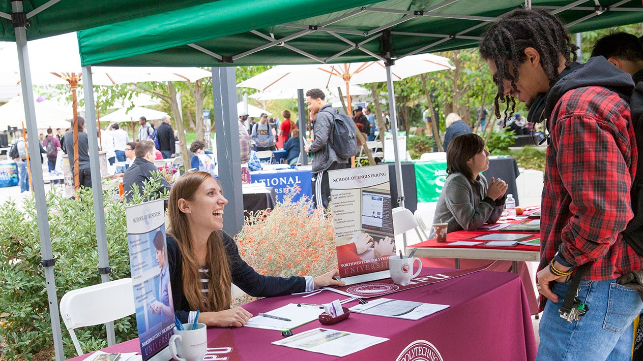 DVC students at a booth at an event on campus