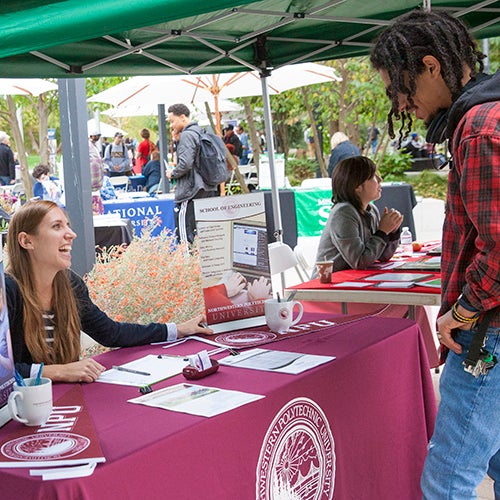 DVC students at a booth at an event on campus