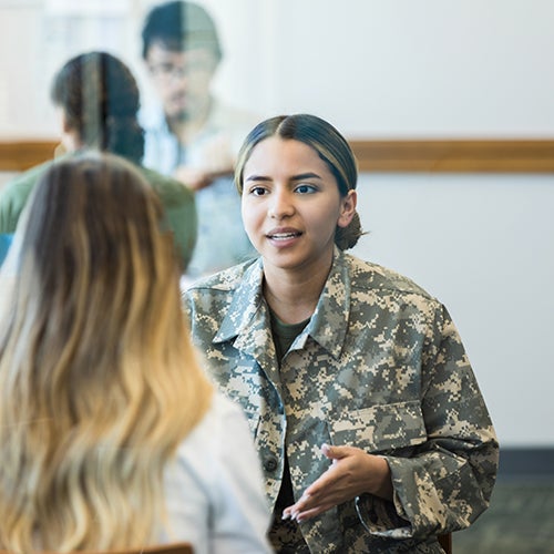 DVC student veteran talking with another student