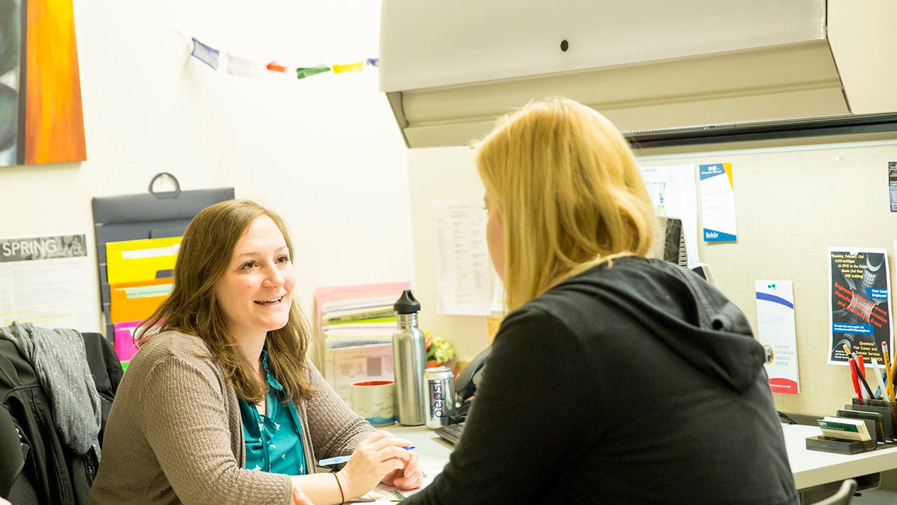 DVC student talking with a financial aid officer