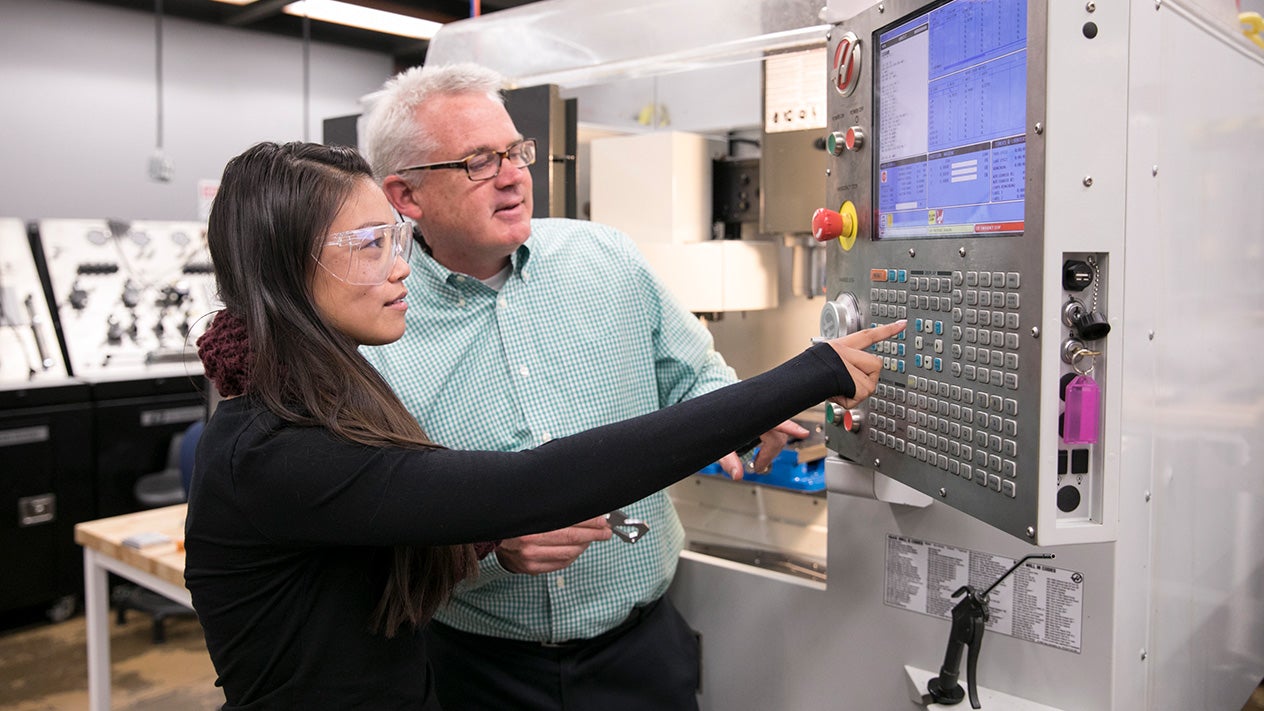 A DVC engineering student and faculty member in class.