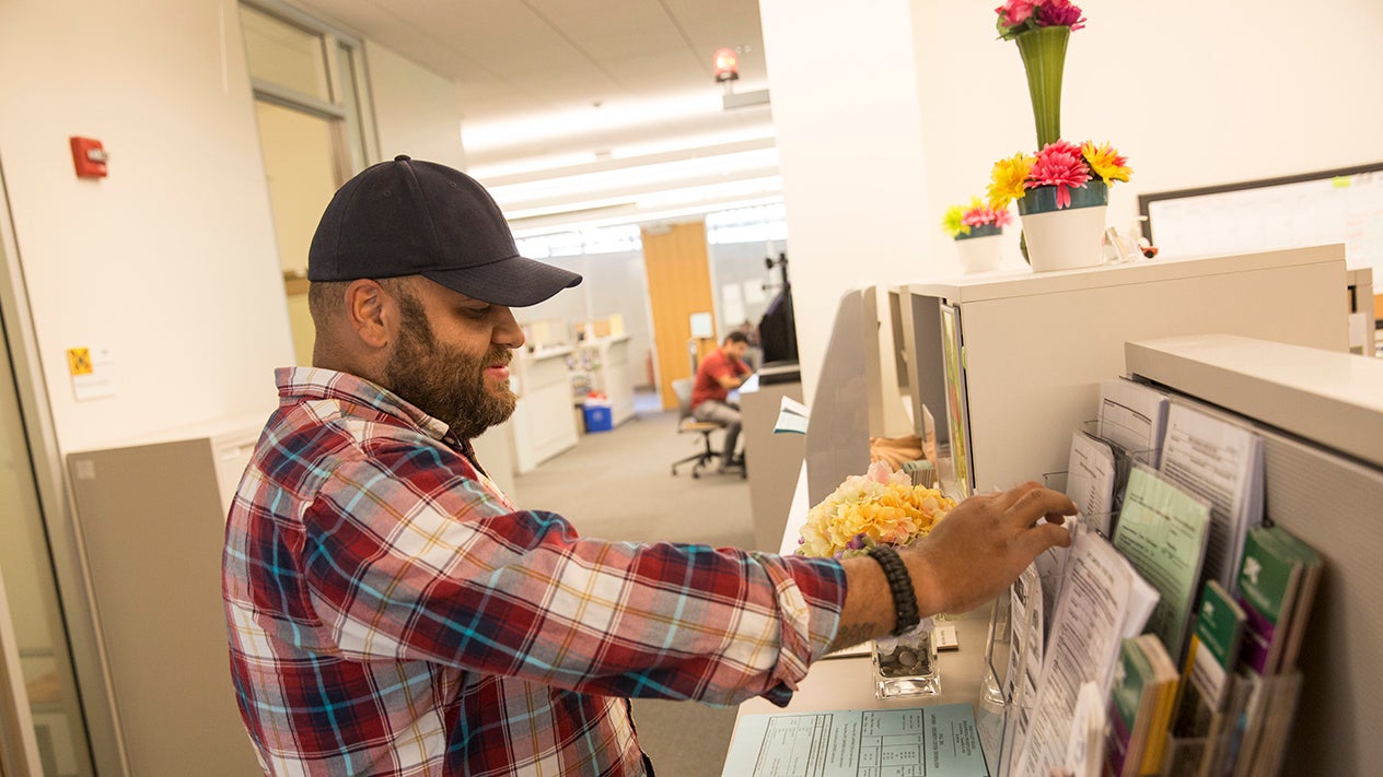 A DVC students browses forms in the Student Services building.