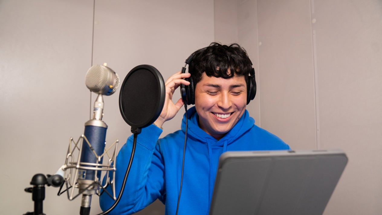 Student recording music in the Music Technology Center