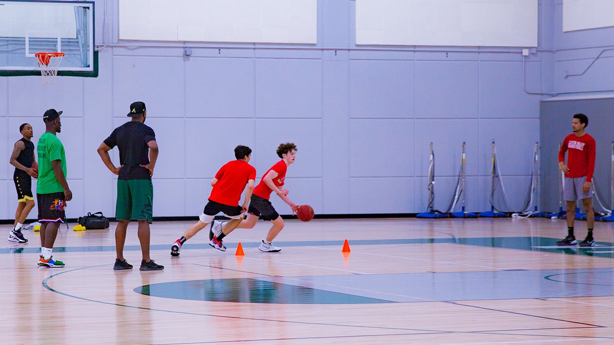 Students playing basketball in DVC gym