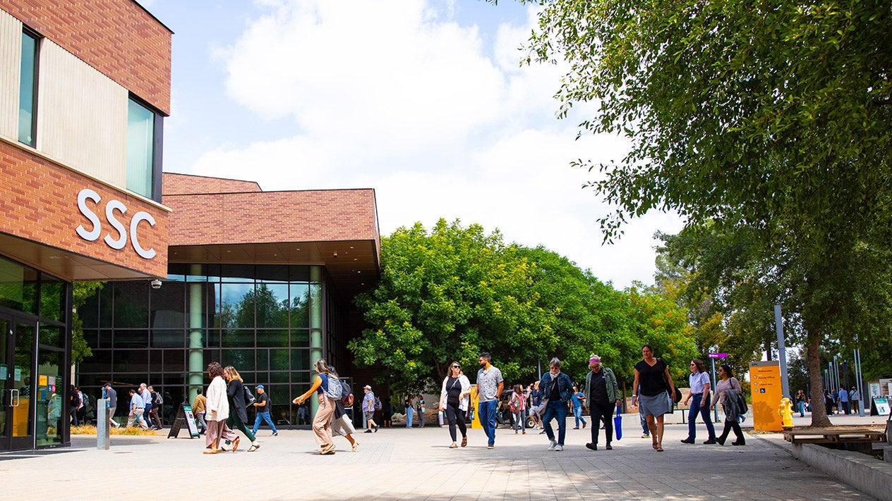 DVC students walking outside the Student Services Center