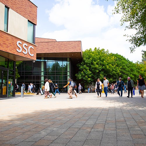 DVC students walking outside the Student Services Center