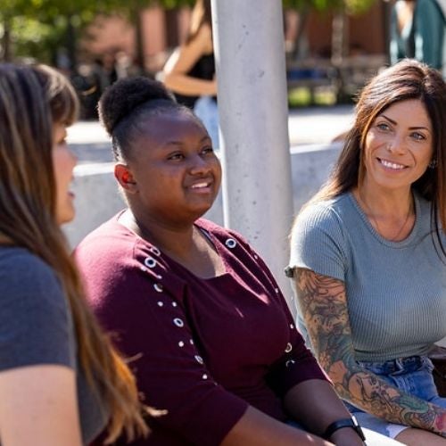 Three students talking