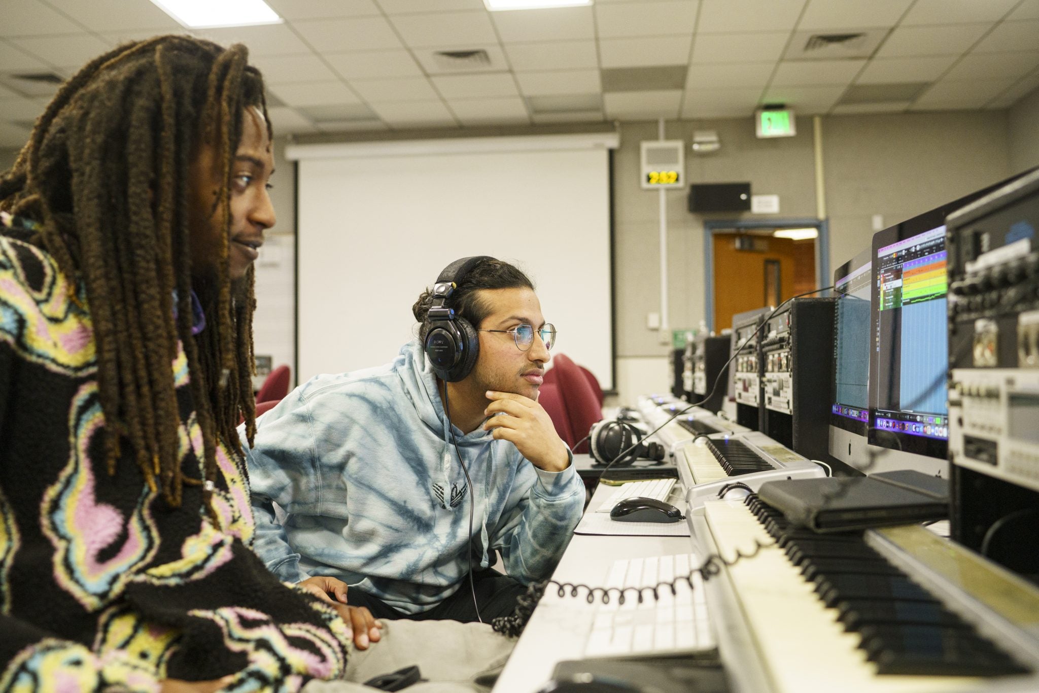 DVC music industry study students sitting in front of their piano keyboards