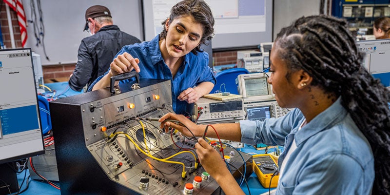 DVC electronics technology students working on a project