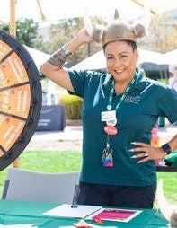 Employee in college gear at festival