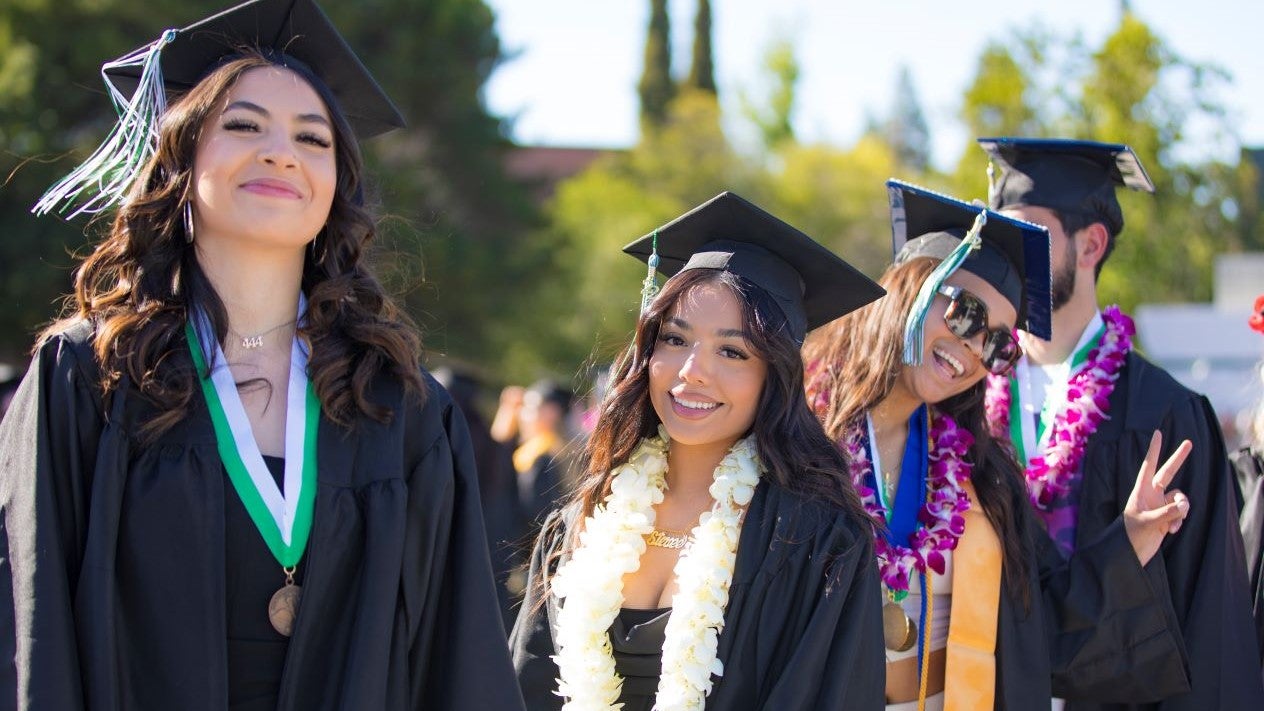 DVC students with grad caps and gowns on for commencement