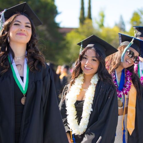 DVC students with grad caps and gowns on for commencement