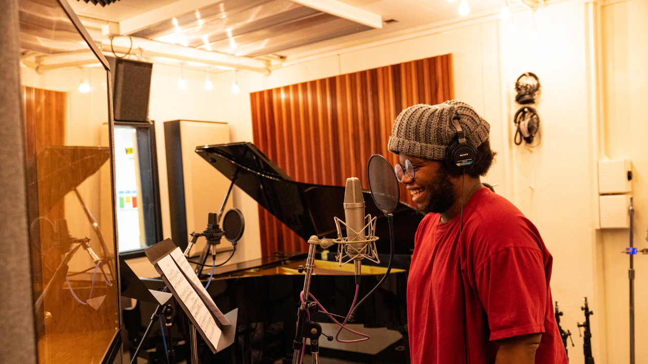 Student recording music in the Recording Studio