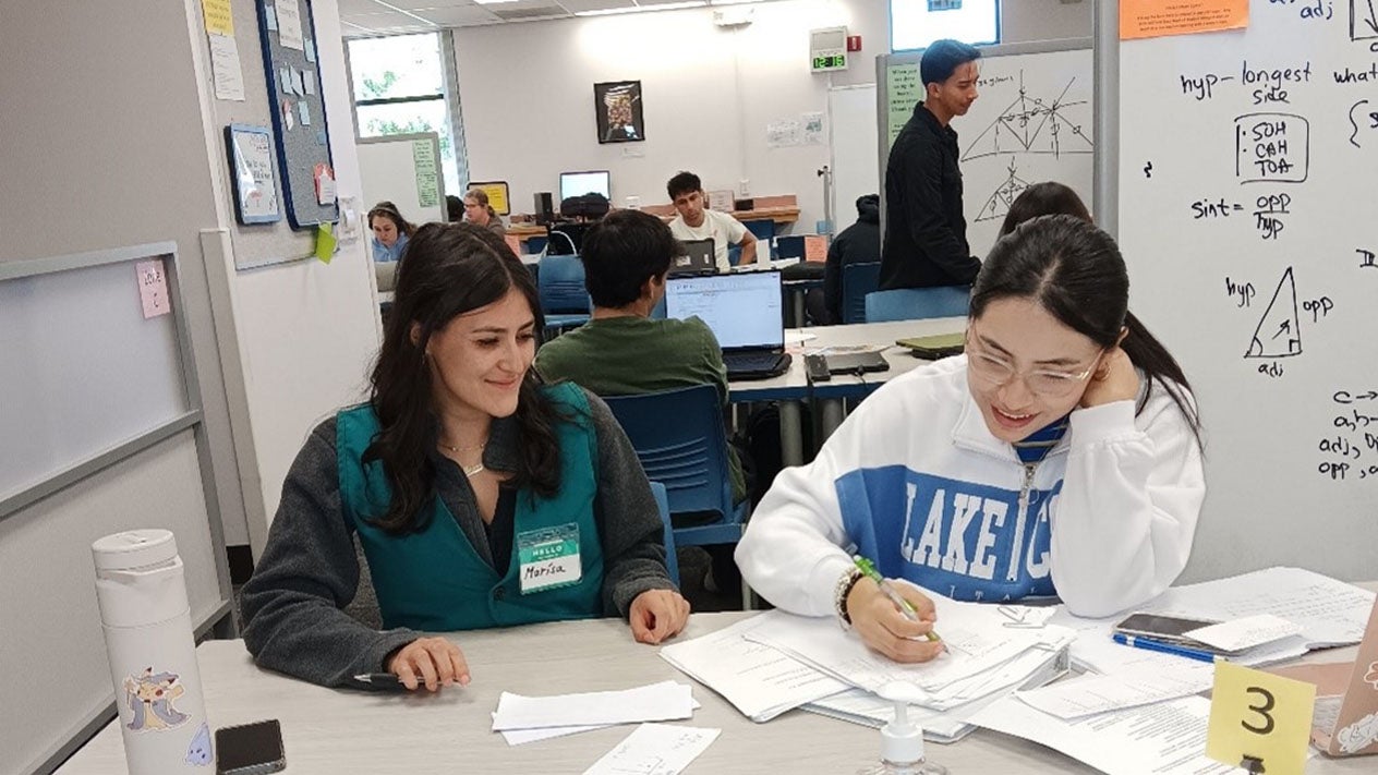 A tutor and student in the Math & Engineering Student Center.