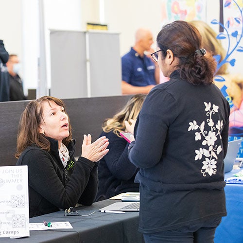 A DVC students talks with a recruiter.