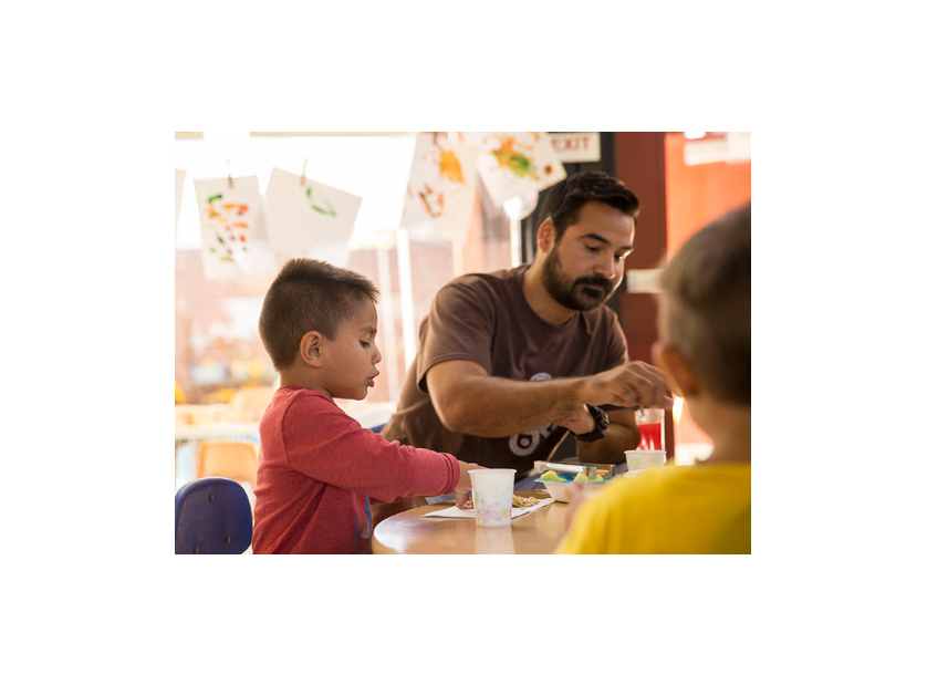 Adult and kid participating in an activity