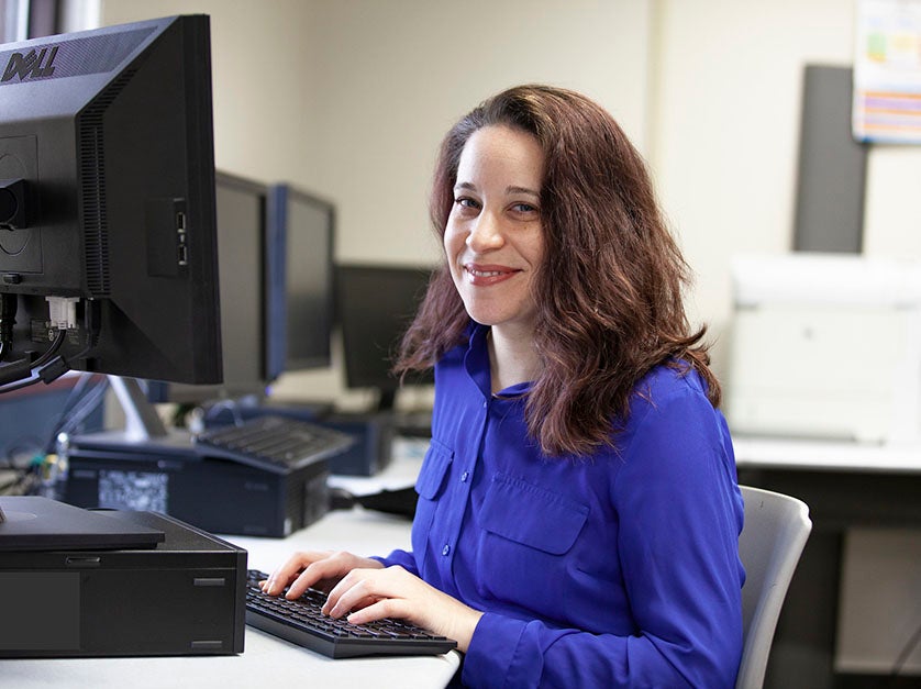 Woman typing on computer