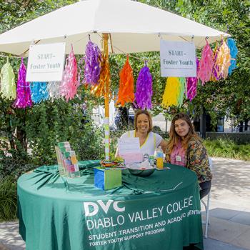 DVC Foster Youth staff at a booth on the Pleasant Hill campus.